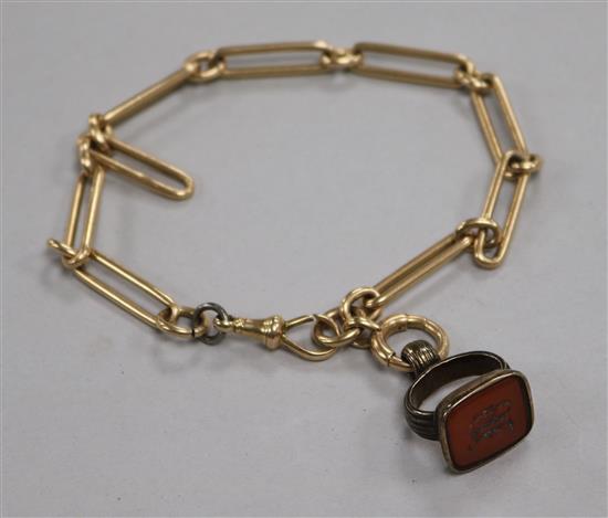 A 15ct gold chain and gilt metal and carnelian set fob.